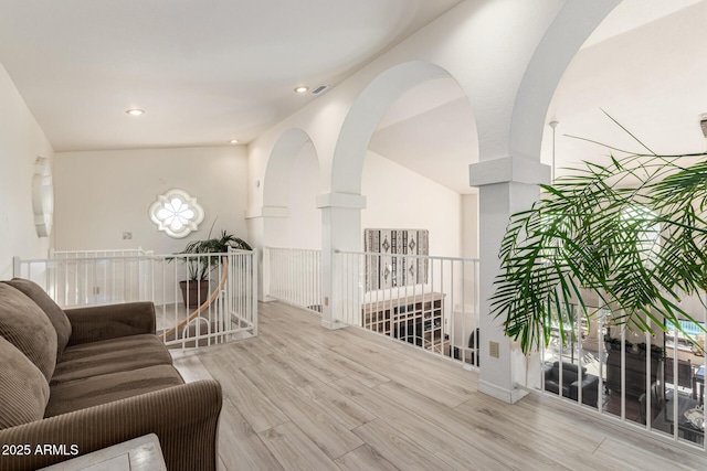 living area with recessed lighting and wood finished floors