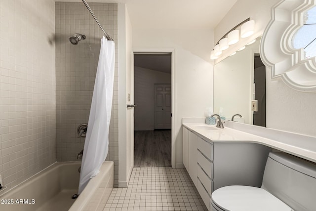 bathroom featuring toilet, tile patterned flooring, shower / bathtub combination with curtain, and vanity