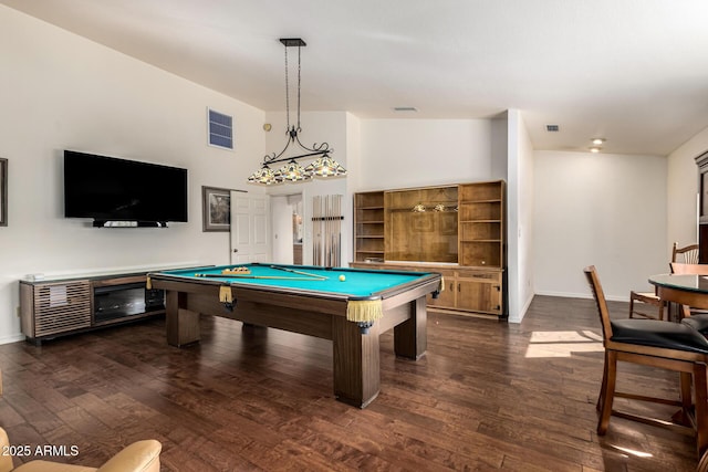 recreation room with dark wood finished floors, visible vents, and baseboards