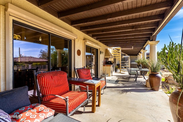 view of patio / terrace featuring stairway