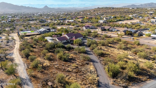 drone / aerial view with a residential view and a mountain view