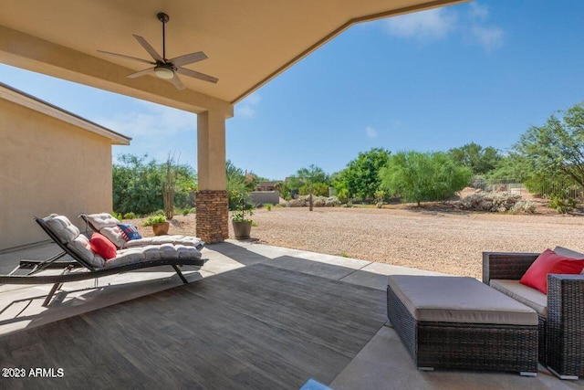 view of patio / terrace featuring ceiling fan and a deck
