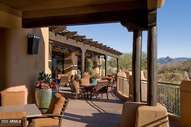 view of patio / terrace with a mountain view