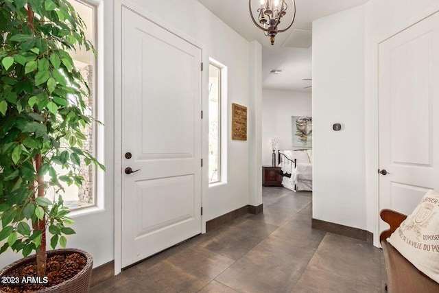 foyer featuring a chandelier
