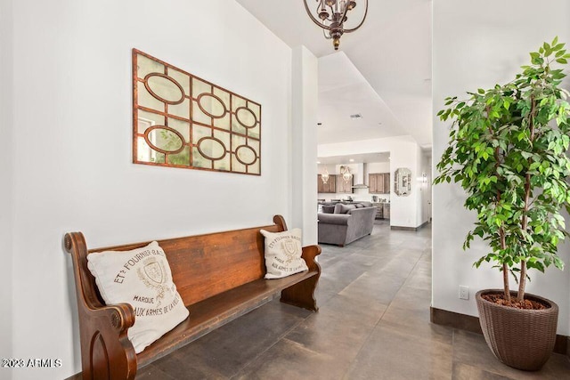 hallway featuring a high ceiling