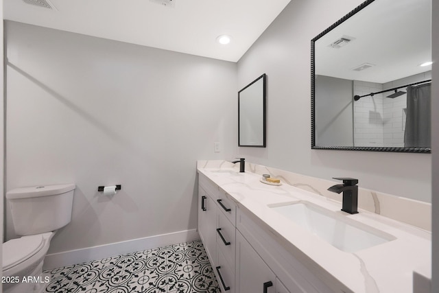 full bath with visible vents, toilet, baseboards, and a sink