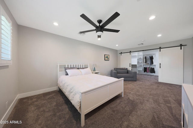 carpeted bedroom with recessed lighting, a barn door, baseboards, and a ceiling fan