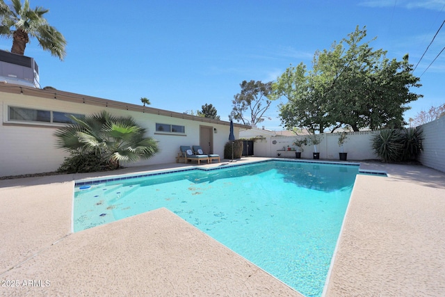 view of swimming pool featuring a patio, a fenced backyard, and a fenced in pool