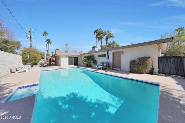 view of swimming pool with a fenced in pool, a patio, and fence