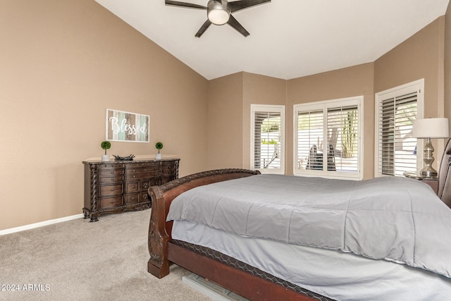 bedroom featuring ceiling fan, light colored carpet, and vaulted ceiling