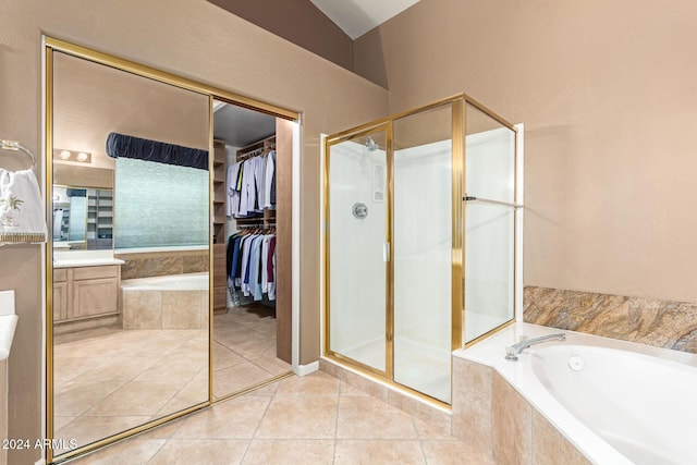 bathroom with shower with separate bathtub, vanity, and tile patterned floors