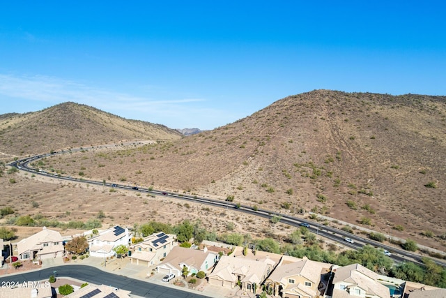 birds eye view of property with a mountain view