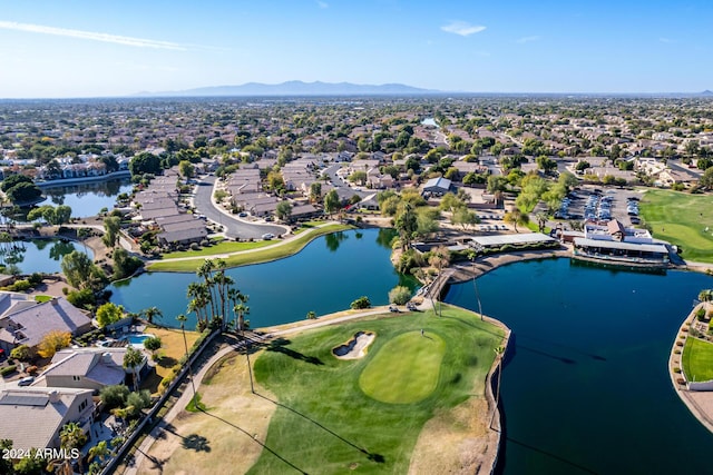 birds eye view of property featuring a water and mountain view