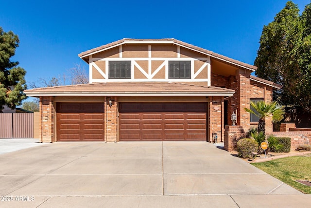 view of front of home featuring an attached garage, brick siding, driveway, a tiled roof, and stucco siding