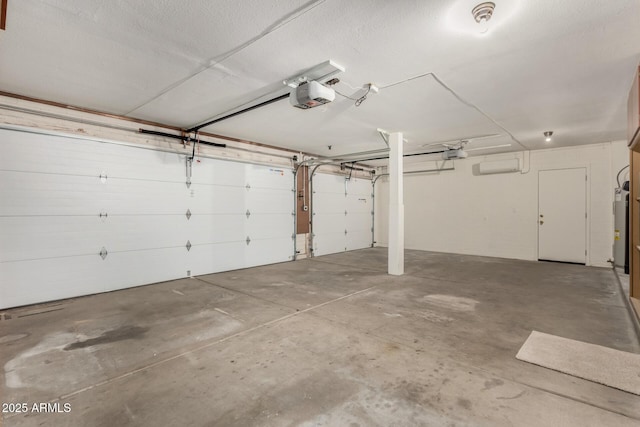 garage with a garage door opener and electric water heater