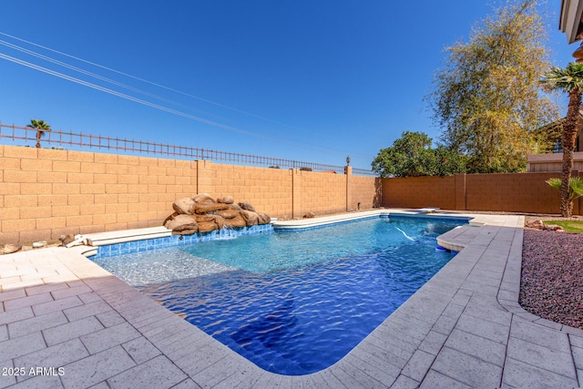 view of pool featuring a patio area and a fenced backyard