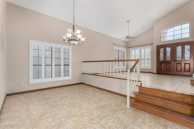 entryway featuring high vaulted ceiling, stairway, baseboards, and light tile patterned floors