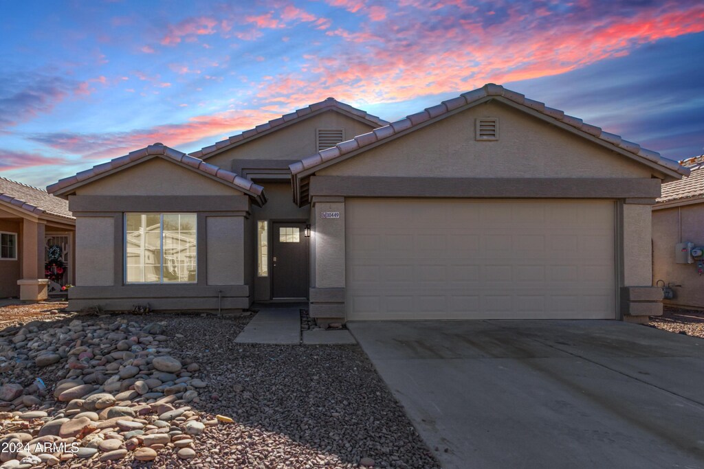 view of front of property with a garage