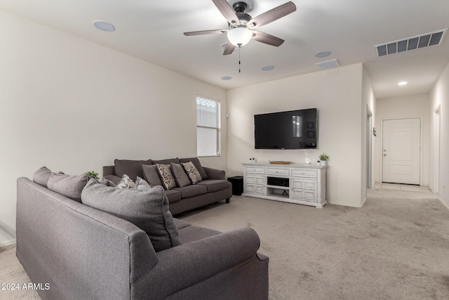 living room with ceiling fan and light colored carpet