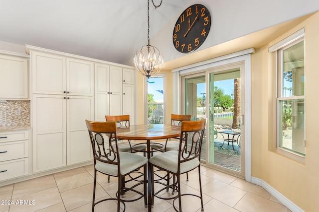 dining area featuring an inviting chandelier and light tile patterned floors