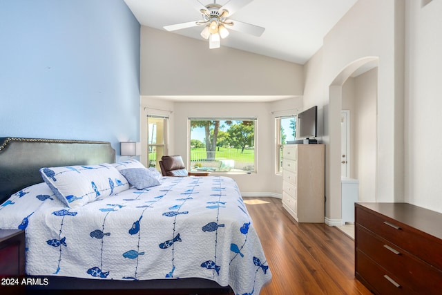 bedroom featuring ceiling fan, vaulted ceiling, and dark hardwood / wood-style flooring