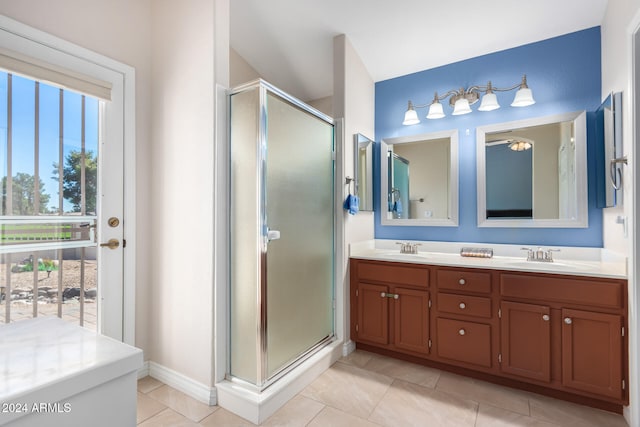 bathroom with vanity, a shower with shower door, and tile patterned flooring