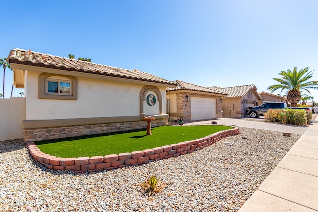 mediterranean / spanish-style house featuring a garage