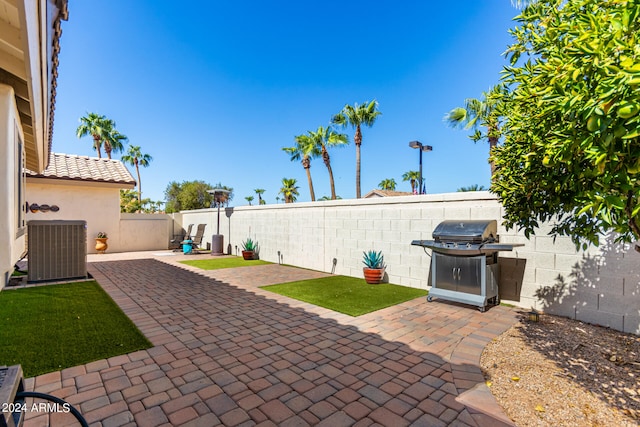 view of patio / terrace featuring central AC and area for grilling