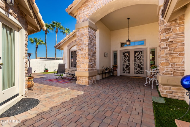 property entrance with a patio area