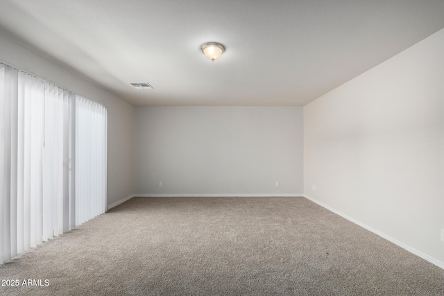 2000 N 36th St Unit 8, Phoenix, AZ 85008 - spare room featuring light colored carpet and baseboards