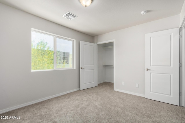 2000 N 36th St Unit 8, Phoenix, AZ 85008 - unfurnished bedroom with carpet floors and a walk in closet