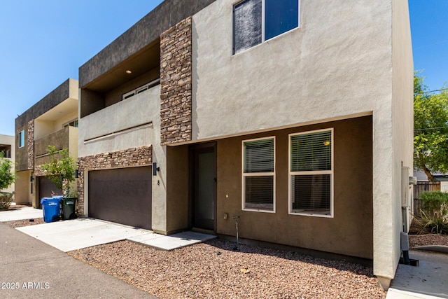 2000 N 36th St Unit 8, Phoenix, AZ 85008 - view of building exterior featuring concrete driveway and an attached garage