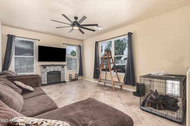 3016 W White Canyon Rd, San Tan Valley, AZ 85144 - tiled living room with a ceiling fan and a fireplace