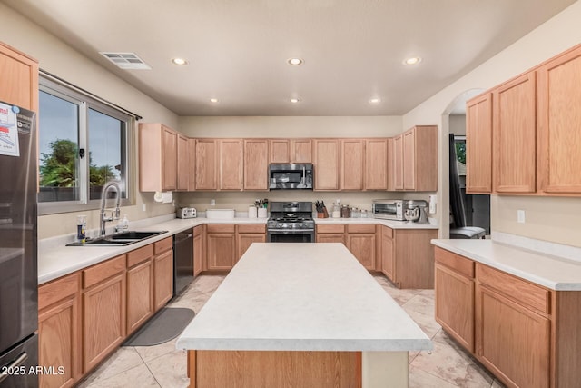 3016 W White Canyon Rd, San Tan Valley, AZ 85144 - kitchen featuring stainless steel appliances, recessed lighting, light countertops, light brown cabinetry, and a kitchen island