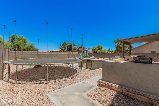 3016 W White Canyon Rd, San Tan Valley, AZ 85144 - fenced backyard with a trampoline