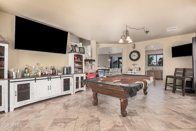 3016 W White Canyon Rd, San Tan Valley, AZ 85144 - game room featuring arched walkways, beverage cooler, a bar, and billiards
