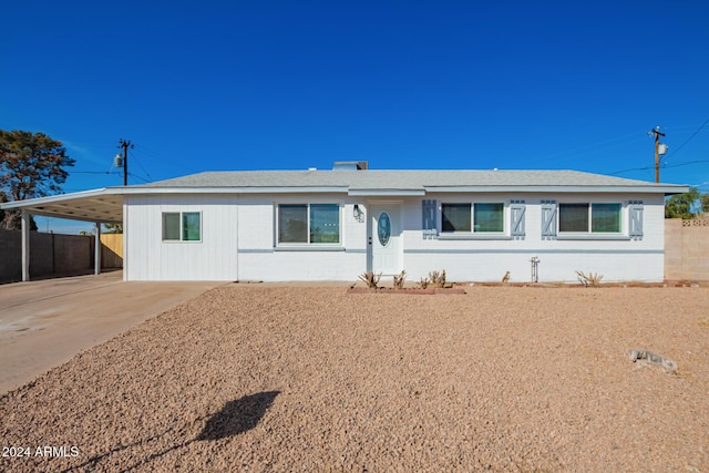 ranch-style home with a carport