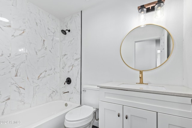 full bathroom with tiled shower / bath combo, toilet, and vanity