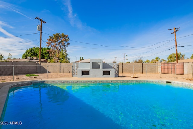 view of pool with a fireplace