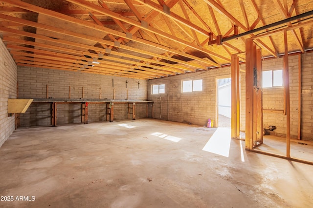 interior space featuring a wealth of natural light and brick wall