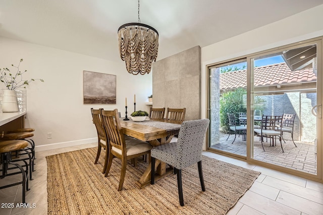 10023 E Sunnyslope Ln, Scottsdale, AZ 85258 - dining space featuring a chandelier, baseboards, and light tile patterned flooring