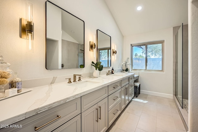 10023 E Sunnyslope Ln, Scottsdale, AZ 85258 - bathroom featuring double vanity, vaulted ceiling, tile patterned flooring, baseboards, and recessed lighting