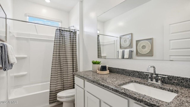 bathroom featuring toilet, vanity, and shower / bathtub combination with curtain