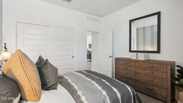 bedroom featuring a closet and visible vents