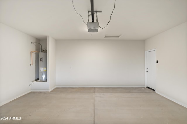 garage with electric water heater, a garage door opener, and baseboards