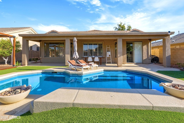 10909 W Chase Ln, Avondale, AZ 85323 - swimming pool featuring an outdoor fire pit and a patio area