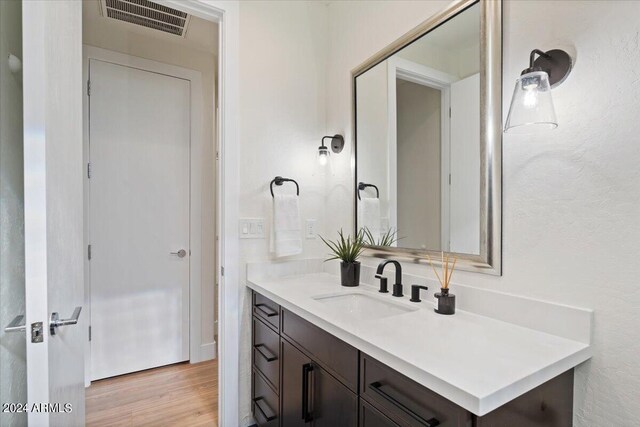 bathroom featuring wood-type flooring and vanity