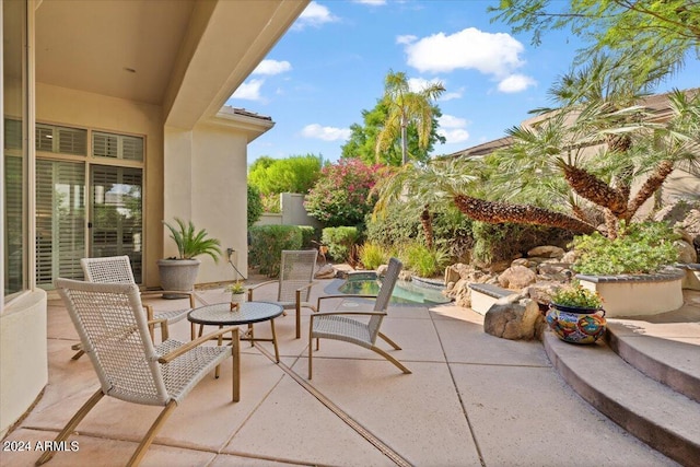 view of patio / terrace featuring an outdoor pool