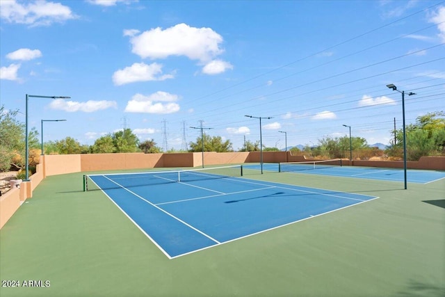 view of sport court with community basketball court and fence