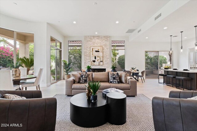 living room with a fireplace and light hardwood / wood-style floors